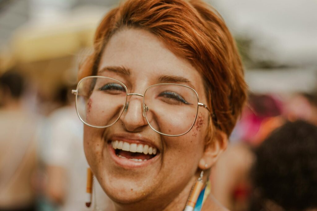 Close-up Portrait of a Smiling Woman with Eyeglasses