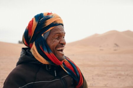 Laughing Bedouin in Desert