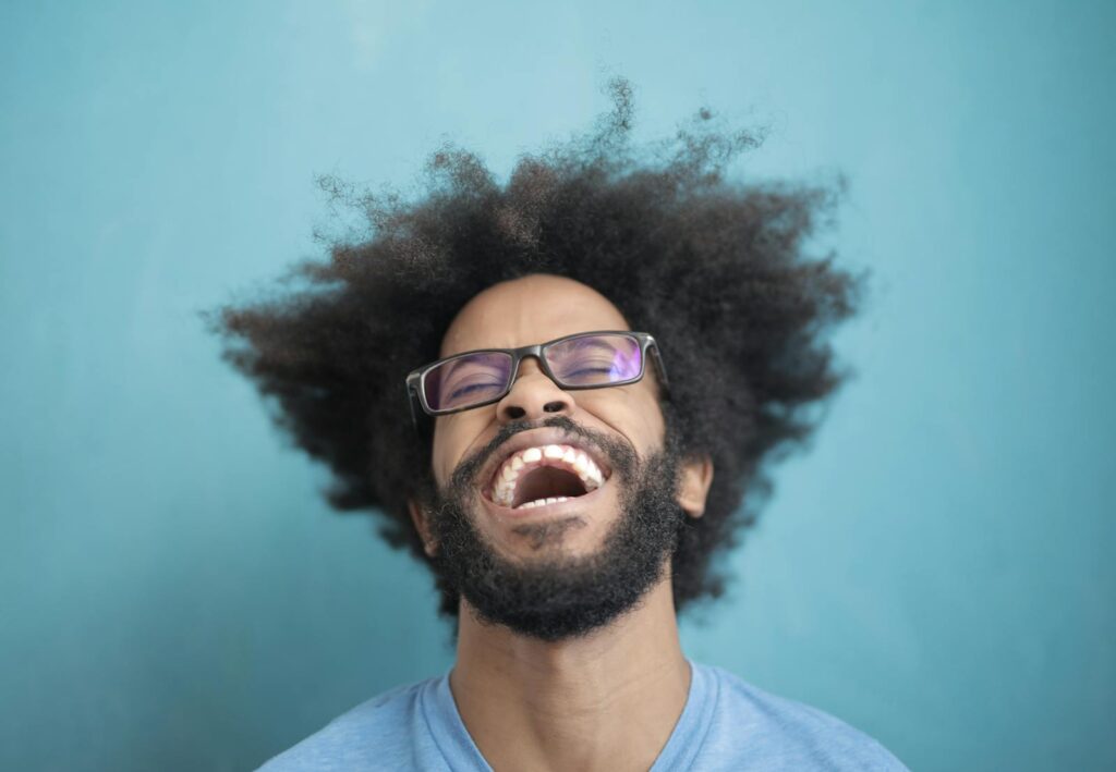 Man In Blue Crew Neck Shirt Wearing Black Framed Eyeglasses