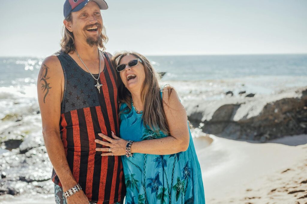 Couple Near Ocean Laughing